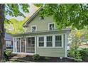 Charming home featuring a screened-in porch and well-manicured landscaping at 4447 N College Ave, Indianapolis, IN 46205