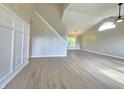 Bright and spacious living room featuring vaulted ceilings, large window, and modern flooring at 6369 Kelsey Dr, Indianapolis, IN 46268