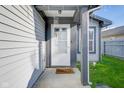 View of front porch that leads to a welcoming door with a wind chime and a 
