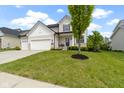 Attractive two-story home with a well-maintained lawn and landscaping at 932 Silverheels Dr, Westfield, IN 46074