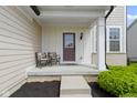 Cozy front porch with seating, offering a welcoming entrance to the home at 932 Silverheels Dr, Westfield, IN 46074