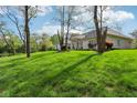 Beautifully landscaped yard surrounding this gorgeous home at 965 W Main St, Greenwood, IN 46142