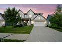 Charming two-story home with a well-manicured lawn and a spacious two car garage, perfect for Gathering living at 9822 Tampico Chase, Fishers, IN 46040