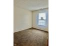 This bedroom has neutral walls and carpet, a window with blinds, and electrical outlets at 1081 Torino Ln, Franklin, IN 46131