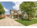 Inviting two-story home featuring a covered porch and an attached two-car garage, ideal for suburban living at 1274 Old Heritage Pl, Greenwood, IN 46143