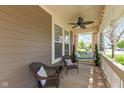 Cozy front porch with wicker seating, a porch swing, and a ceiling fan, great for relaxation and enjoying the outdoors at 1274 Old Heritage Pl, Greenwood, IN 46143