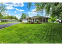 Sprawling green lawn leads to this attractive ranch home with an adjacent detached two car garage at 169 Bayview Dr, Cicero, IN 46034