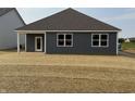 View of the home's rear exterior and yard space, providing a glimpse of the outdoor living potential at 2047 Quail W Dr, Danville, IN 46122