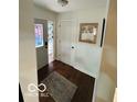 A bright foyer featuring hardwood floors and a decorative stained glass window at 209 Brighton Ct, Greenwood, IN 46143