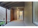 Inviting front porch features a stained glass sidelight and decorative planter at 209 Brighton Ct, Greenwood, IN 46143