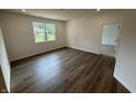 Spacious living room featuring neutral paint, recessed lighting, and hardwood floors at 2159 Warbler St, Danville, IN 46122