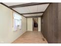 The entryway features a wood paneled wall and a view into the living room at 2319 S I St, Elwood, IN 46036