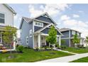 Attractive two-story home with manicured lawn and curb appeal in a residential neighborhood at 2542 Barstow Dr, Whitestown, IN 46075