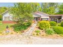 Beautiful home with a red roof, stone pathway, and mature landscaping, with lots of curb appeal at 295 Maple Turn Rd, Martinsville, IN 46151