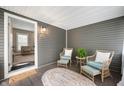 Relaxing front porch featuring comfortable seating, plants, and a welcoming entrance to the house at 3019 W Huntsville Rd, Pendleton, IN 46064