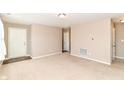 Bright, carpeted living room with neutral walls and modern lighting at 4033 Tahoe Dr, Indianapolis, IN 46235