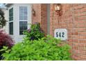 Close up of house number on a brick home with lush landscaping at 542 Hadleigh Ct, Westfield, IN 46074