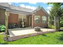 Relaxing backyard patio with outdoor grill, dining table and chairs, and a cozy fire pit at 575 Dylan Dr, Avon, IN 46123