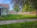 A verdant front lawn provides an inviting view of the neighborhood at 734 W North St, Lebanon, IN 46052