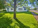 Inviting home featuring a well-kept lawn with verdant grass on a sunny day at 734 W North St, Lebanon, IN 46052