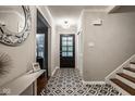 Welcoming foyer with a decorative tile floor, leading to the rest of the home at 7531 Mohawk Ln, Indianapolis, IN 46260