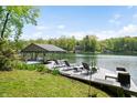Relaxing dock area with comfortable seating and beautiful lake views under a bright sky at 7753 Ivy Dr, Nineveh, IN 46164