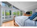 Bright main bedroom featuring large windows with scenic views and hardwood floors at 7753 Ivy Dr, Nineveh, IN 46164