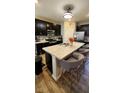 Modern kitchen featuring stainless steel appliances, a large island, and bar stool seating at 11204 Sashing Way, Monrovia, IN 46157