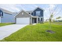Charming two-story home with a well-manicured lawn and inviting curb appeal at 1181 Galaxy Ln, Danville, IN 46122