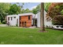 Modern two-story home featuring a beautifully landscaped lawn and mixed material exterior at 11911 Eden Glen Dr, Carmel, IN 46033