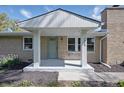 Inviting front porch with stylish pillars and a freshly painted door, enhancing curb appeal at 1328 Toner Dr, Anderson, IN 46012