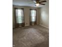 Spacious bedroom with carpet flooring, neutral walls, and plenty of natural light from dual windows at 1716 W Witt Ave, Lebanon, IN 46052