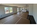 Spacious living area with open-concept design flowing into the kitchen, great for entertaining at 24391 Stout St, Sheridan, IN 46069