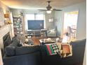 Comfortable living room featuring hardwood floors, fireplace, and neutral-toned decor at 310 S Butler Ave, Indianapolis, IN 46219