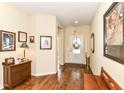 Inviting entryway with hardwood floors, decorative accents, and a view of the front door and foyer at 4039 Amaryllis Dr, Plainfield, IN 46168