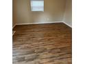 Bedroom with neutral paint and wood floors offers a cozy and inviting atmosphere at 41 S Warman Ave, Indianapolis, IN 46222