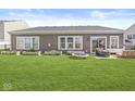 Expansive backyard featuring a well-maintained lawn and raised garden beds, great for entertaining at 5622 Hare Dr, Noblesville, IN 46062