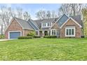 Charming brick home with a well-manicured lawn and attached two-car garage at 5948 Ridge Hill Way, Avon, IN 46123