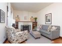 Comfortable living room with a decorative fireplace, built-in shelving, and inviting seating arrangements at 625 Dequincy St, Indianapolis, IN 46201