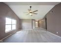 Spacious living room with vaulted ceiling, neutral paint, carpeting and a view of the front entryway at 7131 Blue Ridge Dr, Noblesville, IN 46062