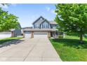 Charming two-story home with a three car garage, blue shutters and beautiful curb appeal at 8178 Eskerban Dr, Avon, IN 46123