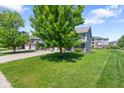 Charming two-story home with a three car garage, blue shutters and beautiful curb appeal at 8178 Eskerban Dr, Avon, IN 46123