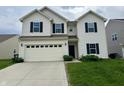 Charming two-story home featuring a spacious two-car garage and well-maintained lawn at 837 Sommersweet Run, Greenwood, IN 46143