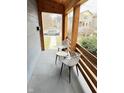 Inviting porch with seating area featuring comfortable chairs and a quaint table at 929 W Roache St, Indianapolis, IN 46208