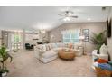 Open-concept living room featuring a comfortable sectional and stylish furnishings at 12446 Deerview Dr, Noblesville, IN 46060