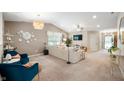 Bright living room with plush seating, modern decor, and neutral color palette at 12446 Deerview Dr, Noblesville, IN 46060