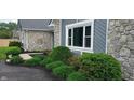 Attractive landscaping featuring stone accents, lush greenery, and well-maintained mulch beds at 12681 E 79Th St, Indianapolis, IN 46236