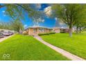 Pleasant one-story home situated on a well-manicured lawn at 2150 Main St, Beech Grove, IN 46107
