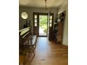 Inviting foyer with hardwood floors and classic decor welcomes you home at 2407 Overlook Dr, Shelbyville, IN 46176