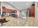 Open eat-in kitchen featuring granite countertops, stainless appliances and lots of cabinet space at 3334 Old Field Ln, Columbus, IN 47203